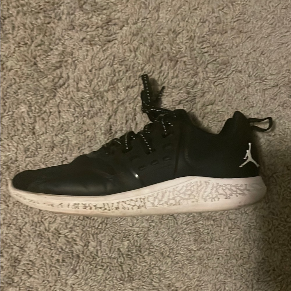 Jordan Black and White Athletic Shoes with Sleek Design